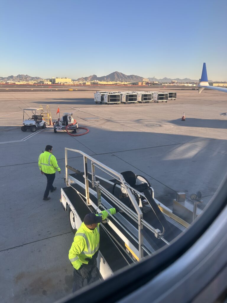 Wheelchair getting loaded onto an airplane