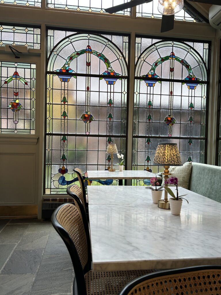 Greenhouse coffee shop with stained glass windows